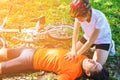 First Aid Emergency is CPR.The man who face heart attack and shock was helped by his friend after the bicycle race.