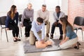 First Aid Instructor Showing CPR Training On Dummy Royalty Free Stock Photo