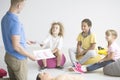 First aid instructor teaching children