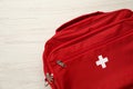 First aid kit bag on white wooden table, closeup Royalty Free Stock Photo