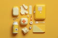 first aid kit-bandages, band-aid, tablets, medical gloves, face mask, spray on a yellow background AI Generated Royalty Free Stock Photo