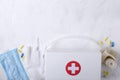 First aid kit and collection of supplies for medical treatments on the white background.Empty space for text Royalty Free Stock Photo