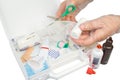 First-aid kit and hands with gloves Royalty Free Stock Photo