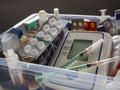 First aid kit with medicines. Tonometer, syringes, tablets and other medical devices are placed in a plastic box. Royalty Free Stock Photo