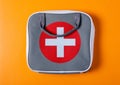 First aid kit on orange background Royalty Free Stock Photo