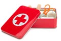 A first aid kit in a red metal tin