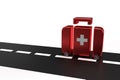 First aid kit suitcase on wheels on road on isolated background