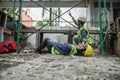 First aid support accident at work of builder worker in construction site. Accident falls from the scaffolding on floor, Foreman Royalty Free Stock Photo