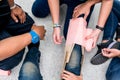 At First Aid Training Classroom, Students are trying to splint the leg of a patient`s broken leg incident with cardboard and elast Royalty Free Stock Photo