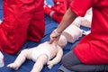 Practicing CPR of a baby on infant dummy