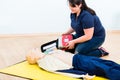 First aider trainee learning revival with defibrillator