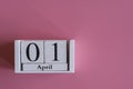The first of April on a pink backgroun. copy space Royalty Free Stock Photo