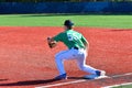 A first baseman catching a ball thrown to them at the base Royalty Free Stock Photo