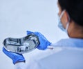 The first batch of fully tested vaccines. High angle shot of an unrecognizable female scientist carrying a container