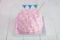 First birthday cakemade of pink cream roses with text ONE garland on top Royalty Free Stock Photo