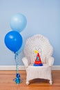 First birthday chair, balloons, hat Royalty Free Stock Photo