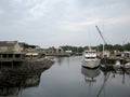 First Chance Whale Watch boat at Dock and The Boathouse Waterfront Hotel & Restaurant along waterway