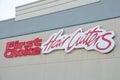 tor, canada - july 31, 2023: first choice hair cutters logo sign on store wall close up, red and white. p Royalty Free Stock Photo