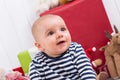 First Christmas: baby amongst presents - children eyes Royalty Free Stock Photo