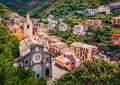 First city of the Cique Terre sequence of hill cities - Riomaggiore with tower of Church of San Giovanni Battista. Wonderful summe