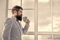 But first coffee. His big day. Wedding morning concept. Wedding day. Groom bearded hipster man wear blue tuxedo and bow Royalty Free Stock Photo