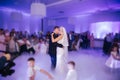 First dance of stylish wedding couple. Handsome groom and elegant bride in the restaurant Royalty Free Stock Photo