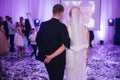 First dance of stylish wedding couple. Handsome groom and elegant bride in the restaurant Royalty Free Stock Photo