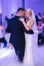 First dance of stylish wedding couple. Handsome groom and elegant bride in the restaurant Royalty Free Stock Photo