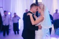 First dance of stylish wedding couple. Handsome groom and elegant bride in the restaurant Royalty Free Stock Photo