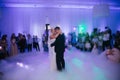 First dance of stylish wedding couple. Handsome groom and elegant bride in the restaurant Royalty Free Stock Photo