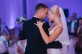 Portrait of first dance of stylish wedding couple. Handsome groom and elegant bride in the restaurant Royalty Free Stock Photo