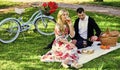First Date Ideas Guaranteed to Win Her Heart. Enjoying their perfect date. Happy loving couple relaxing in park with Royalty Free Stock Photo