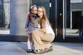 First day in the fall. back to school kids. mother lead little schoolgirl in uniform, schoolbag in the first grade.