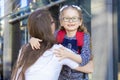 First day in the fall. back to school kids. mother lead little schoolgirl in uniform, schoolbag in the first grade