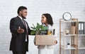 First day at office. African American businessman welcoming new female employee to his team at office Royalty Free Stock Photo