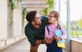 First day at school. father leads little child school girl in f