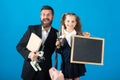 First day at school. Father and little child school girl in first grade. Amazed teacher with excited happy pupil school Royalty Free Stock Photo