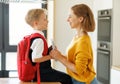 Mother preparing son for school studies Royalty Free Stock Photo