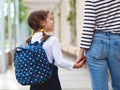 First day at school. mother leads little child school girl in f Royalty Free Stock Photo
