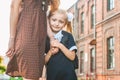 First day at school. Mother leads a little child school girl in first grade Royalty Free Stock Photo