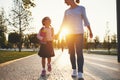 First day at school. mother leads little child school girl in f