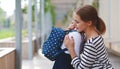 First day at school. mother leads little child school girl in f Royalty Free Stock Photo