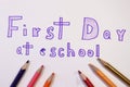 First day at school writing with purple pen. As decoration used colourful pencils Royalty Free Stock Photo