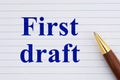 First draft concept on white lined loose leaf notebook paper with pen Royalty Free Stock Photo