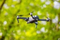 First drone mavic pro model flies in green park. Restricted areas for photography