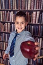 First-grader boy with red apple Royalty Free Stock Photo
