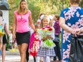 First grader goes school with his mother and younger sister