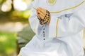 First Holy Communion. A child holding a rosary