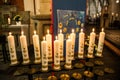 First holy communion or confirmation burning candles rowed up in church before ceremony beautiful decoration