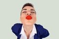 First kiss, unwanted kiss concept. Closeup portrait of nerdy young funny distorted woman face with big red lips eyes closed trying Royalty Free Stock Photo